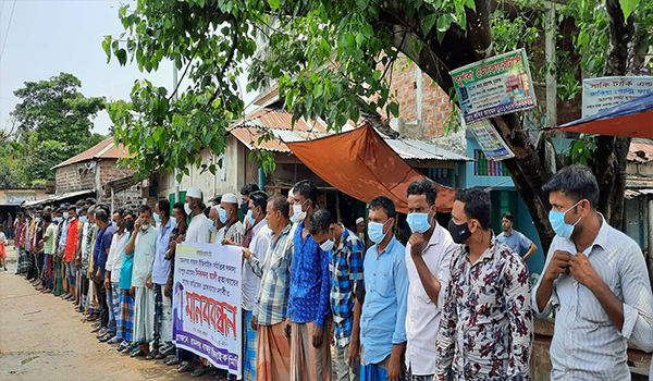 সুনামগঞ্জে গলা কেটে সিকন্দর আলী হত্যাকান্ডের সাথে জড়িতদের গ্রেফতারের দাবীতে মানববন্ধন